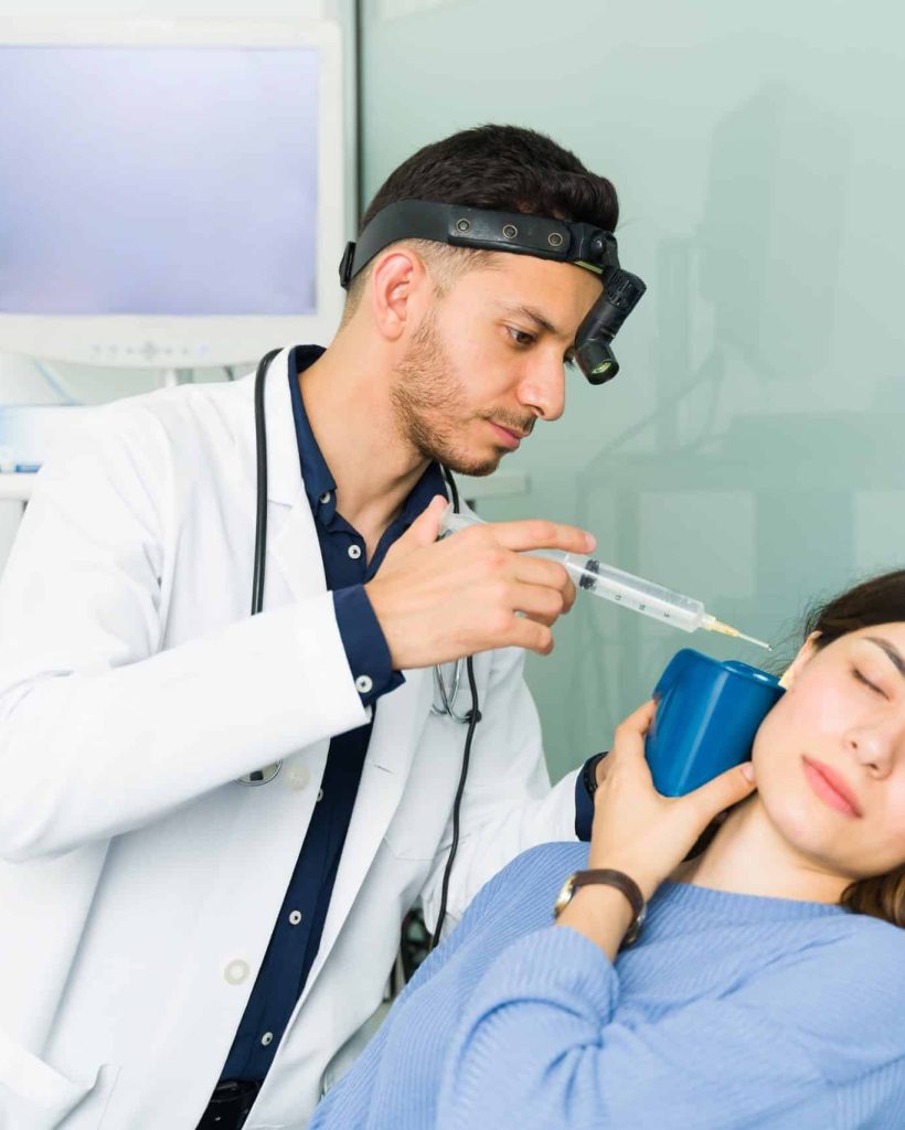 Distressed,Young,Woman,Getting,Her,Ears,Cleaned.,Otolaryngologist,Doctor,Removing